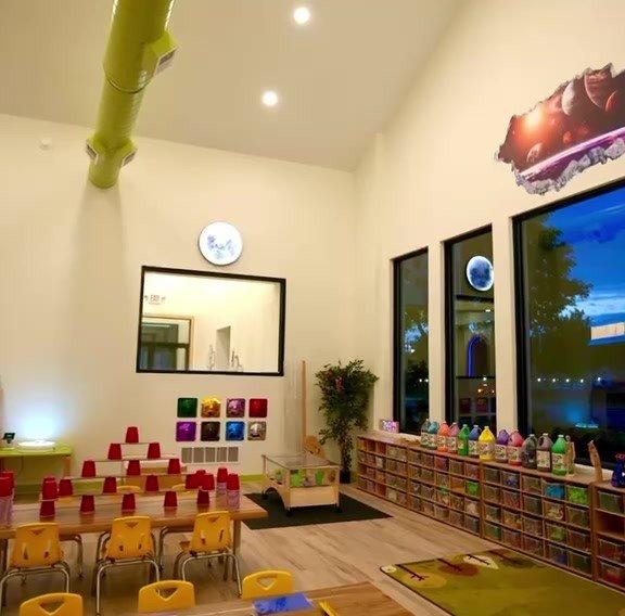 STEM classroom with light tables, cup towers and art supplies